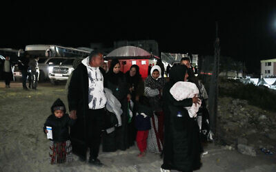 Palestinians are welcomed by relatives after they enter Gaza from Egypt following the long-awaited reopening of the Rafah border crossing, in Khan Younis, southern Gaza Strip, February 5, 2026. (AP Photo/Abdel Kareem Hana)
