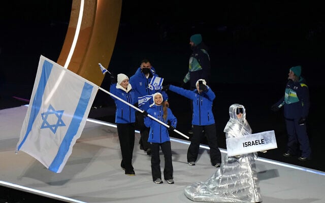 Mariia Seniuk, flag bearer of Israel, walks during the Olympic opening ceremony at the 2026 Winter Olympics, in Milan, Italy, February 6, 2026. (AP Photo/Francisco Seco) Mariia Seniuk, flag bearer of Israel, walks during the Olympic opening ceremony at the 2026 Winter Olympics, in Milan, Italy, February 6, 2026. (AP Photo/Francisco Seco)