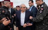 Lebanese Prime Minister Nawaf Salam, center, tours areas in southern Lebanon along the border with Israel in the village of Tayr Harfa, February 7, 2026. (AP Photo/Mohammed Zaatari)