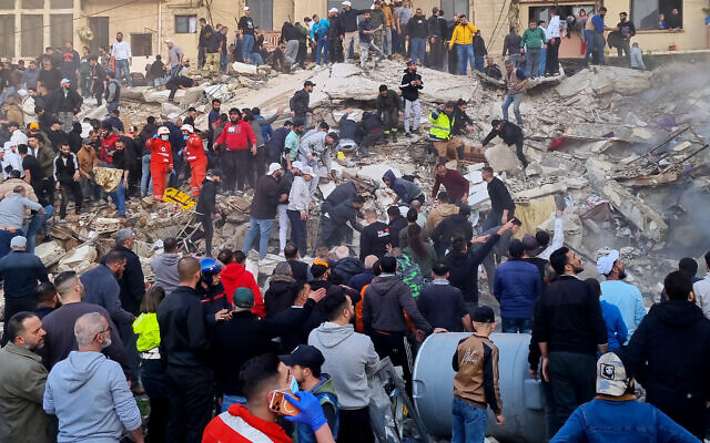 Rescue workers and residents search for survivors in the rubble of a building that collapsed in the northern city of Tripoli, Lebanon, February 8, 2026. (AP)