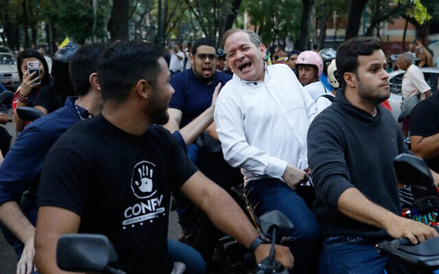 Opposition leader Juan Pablo Guanipa rides on the back of a motorcycle after his release from prison in Caracas, Venezuela, February 8, 2026. (AP Photo/Cristian Hernandez) Opposition leader Juan Pablo Guanipa rides on the back of a motorcycle after his release from prison in Caracas, Venezuela, February 8, 2026. (AP Photo/Cristian Hernandez)