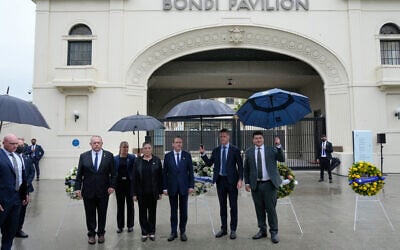 President Isaac Herzog, center, visits Bondi Beach in Sydney, February 9, 2026. (AP/Rick Rycroft) President Isaac Herzog, center, visits Bondi Beach in Sydney, February 9, 2026. (AP/Rick Rycroft)
