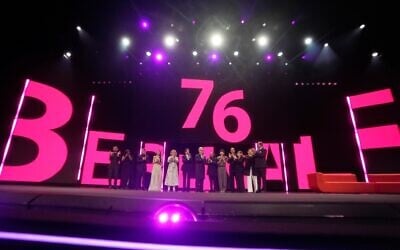 Sean Baker, third from left, Michelle Yeoh, Tricia Tuttle, Wim Wenders, Min Bahadur Bhamat, Bae Doona, Reinaldo Marcus Green, Ewa Puszczynska and Mitsuyo Miyazaki attend the opening ceremony of the International Film Festival, Berlinale, in Berlin, February 12, 2026. (AP Photo/Markus Schreiber).