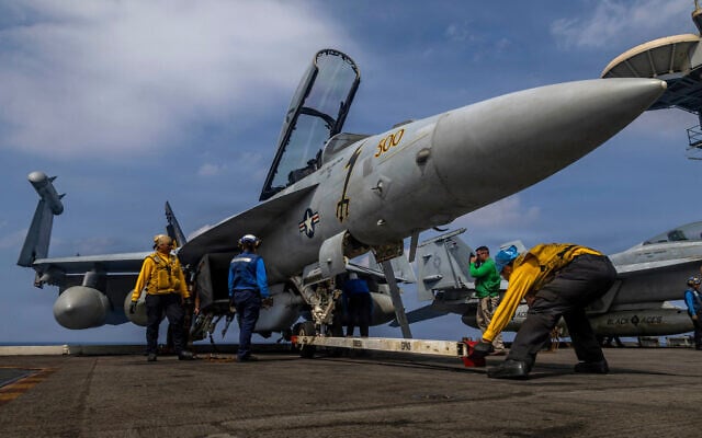 This photo provided by the US Navy shows sailors preparing a Boeing EA-18G Growler on the flight deck of the Nimitz-class aircraft carrier USS Abraham Lincoln in the Indian Ocean on January 21, 2026. (Mass Communication Specialist Seaman Daniel Kimmelman/US Navy via AP, File) This photo provided by the US Navy shows sailors preparing a Boeing EA-18G Growler on the flight deck of the Nimitz-class aircraft carrier USS Abraham Lincoln in the Indian Ocean on January 21, 2026. (Mass Communication Specialist Seaman Daniel Kimmelman/US Navy via AP, File)