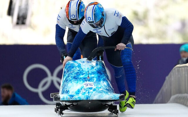 Israel's Adam Edelman, right, and Menachem Chen start for a two-man bobsled run at the 2026 Winter Olympics, in Cortina d'Ampezzo, Italy, Feb. 16, 2026. (AP/Alessandra Tarantino) Israel's Adam Edelman, right, and Menachem Chen start for a two-man bobsled run at the 2026 Winter Olympics, in Cortina d'Ampezzo, Italy, Feb. 16, 2026. (AP/Alessandra Tarantino)