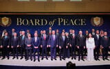 US President Donald Trump stands with other world leaders before a Board of Peace meeting at the US Institute of Peace in Washington, February 19, 2026. (AP Photo/Mark Schiefelbein)