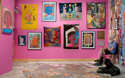 Isaiah Zagar sits with his dog Blue at the 'Dear Julia' exhibit during an interview at Philadelphia's Magic Gardens, May 26, 2016. (AP Photo/Matt Rourke, File)