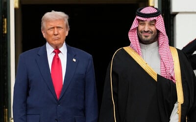 US President Donald Trump stands with Saudi Arabia's Crown Prince Mohammed bin Salman on his visit to the White House, November 18, 2025, in Washington. (AP/Mark Schiefelbein)