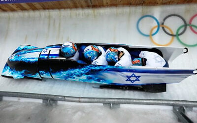 Israel's AJ Edelman (left) Menachem Chen, Uri Zisman and Omer Katz slide down the track during a four-man bobsleigh run at the 2026 Winter Olympics, in Cortina d'Ampezzo, Italy, February 21, 2026. (AP/Aijaz Rahi)