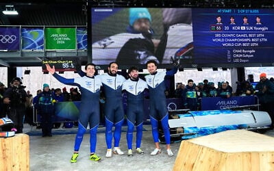 Israel's AJ Edelman, left, Menachem Chen, Uri Zisman and Omer Katz arrive at the finish during a four-man bobsleigh run at the 2026 Winter Olympics, in Cortina d'Ampezzo, Italy, Feb. 21, 2026. (AP/Alessandra Tarantino)