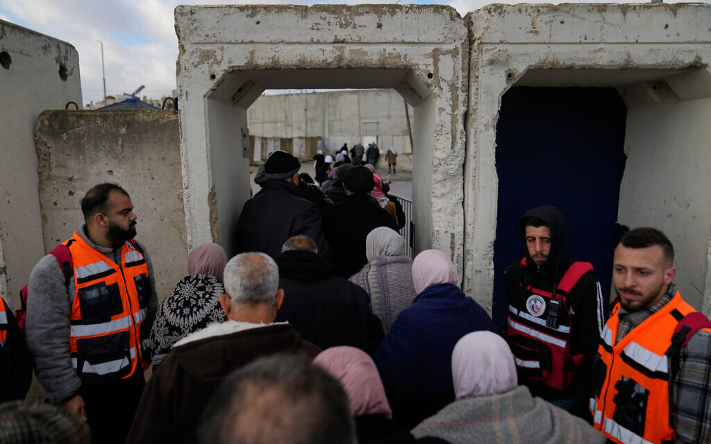 Palestinian worshipers pass through an Israeli checkpoint between the West Bank city of Ramallah and Jerusalem on their way to attend Friday prayers at Al-Aqsa Mosque during Ramadan, Feb. 27, 2026. (AP/Nasser Nasser)