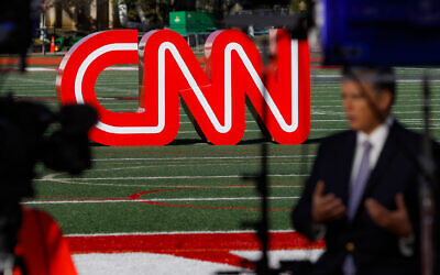 A journalist records video near a CNN sign on an athletic field outside the Clements Recreation Center where the CNN/New York Times will host the Democratic presidential primary debate at Otterbein University on October 14, 2019, in Westerville, Ohio. (AP Photo/John Minchillo, File) A journalist records video near a CNN sign on an athletic field outside the Clements Recreation Center where the CNN/New York Times will host the Democratic presidential primary debate at Otterbein University on October 14, 2019, in Westerville, Ohio. (AP Photo/John Minchillo, File)
