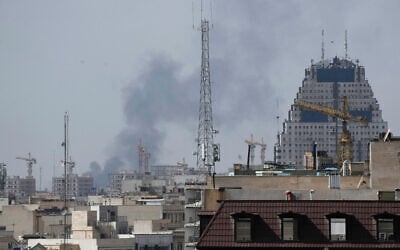 Smoke rises on the skyline after an explosion in Tehran, Iran, February 28, 2026. (AP Photo/Vahid Salemi)