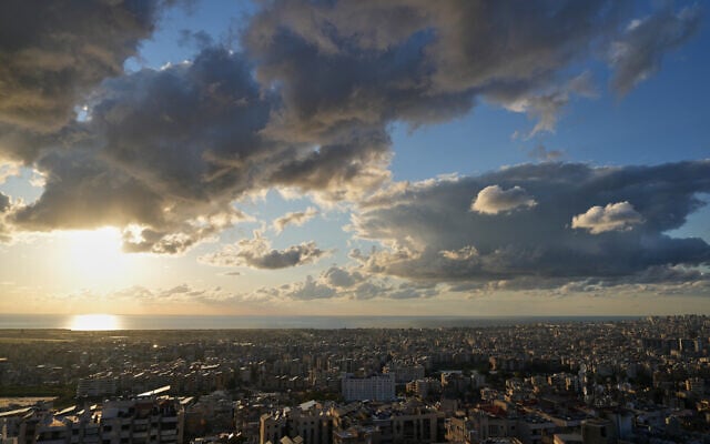 Clouds cover is heavy over the southern suburbs of Beirut, Lebanon, at sunset Saturday, Feb. 28, 2026. (AP Photo/Hassan Ammar) Clouds cover is heavy over the southern suburbs of Beirut, Lebanon, at sunset Saturday, Feb. 28, 2026. (AP Photo/Hassan Ammar)