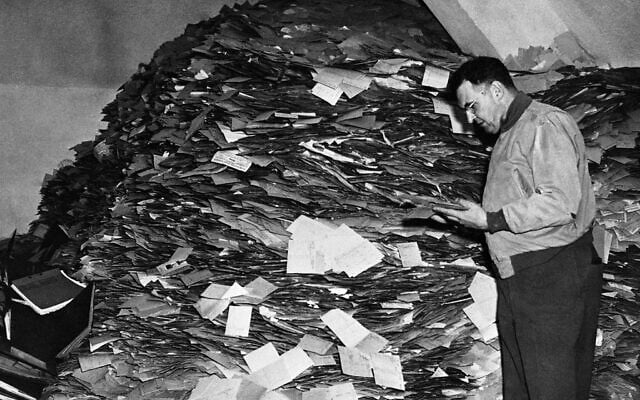 The entire administrative headquarters of the Nazi party have been discovered in Munich, Germany. The bulk of the records, comprising forty tons of documents including twelve million membership and filing cards, were discovered in a paper mill on the outskirts of the town, whilst the remainder were found in the strong room of the Munich party headquarters, and stored in four different offices in the city. Major William D. Browne, Security Officer, and former detective who was instrumental in making the discovery of the Nazi Party master files, inspects the huge pile of cards in the Munich paper mills, on Oct. 28, 1945. (AP Photo) The entire administrative headquarters of the Nazi party have been discovered in Munich, Germany. The bulk of the records, comprising forty tons of documents including twelve million membership and filing cards, were discovered in a paper mill on the outskirts of the town, whilst the remainder were found in the strong room of the Munich party headquarters, and stored in four different offices in the city. Major William D. Browne, Security Officer, and former detective who was instrumental in making the discovery of the Nazi Party master files, inspects the huge pile of cards in the Munich paper mills, on Oct. 28, 1945. (AP Photo)