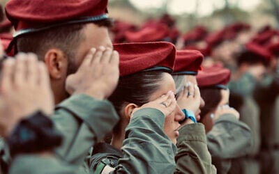 Israeli soldiers from the Oketz unit take part in a memorial ceremony on May 4, 2025. (Oren Cohen/Flash90) Israeli soldiers from the Oketz unit take part in a memorial ceremony on May 4, 2025. (Oren Cohen/Flash90)
