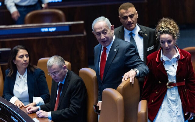 Prime Minister Benjamin Netanyahu (center) attends a Knesset plenum session marking the body's 77th birthday and the 60th anniversary of its building, on February 2, 2026. (Yonatan Sindel/Flash90)
