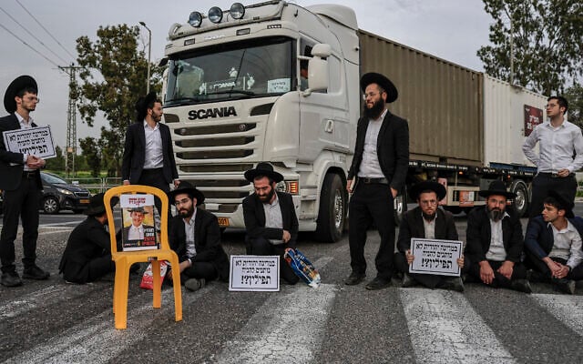 Ultra-Orthodox Jewish men block a road during a protest against the jailing of yeshiva students at the Gilat junction, near the southern Israeli city of Ofakim, February 9, 2026. (Tsafrir Abayov/Flash90) Ultra-Orthodox Jewish men block a road during a protest against the jailing of yeshiva students at the Gilat junction, near the southern Israeli city of Ofakim, February 9, 2026. (Tsafrir Abayov/Flash90)