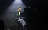 Former hostage Alon Ohel performs with Israeli artists during a concert in Tel Aviv, on February 9, 2026. (Yehoshua Yosef/Flash90)