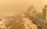 The beach in Tel Aviv during a dust storm, February 14, 2026. (Erik Marmor/Flash90)