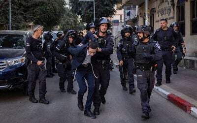 Ultra-Orthodox man arrested by police during riots following an assault on two female Israeli soldiers in Bnei Brak, central Israel, February 15, 2026. (Flash90)