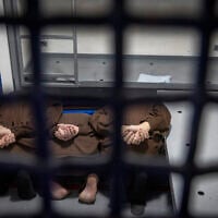 Hamas Nukhba Battalion terrorists captured during the October 7 massacre are seen in a jail cell at a prison in central Israel, where high-risk Hamas prisoners captured during the recent war are being held, February 17, 2026. (Chaim Goldberg/Flash90)