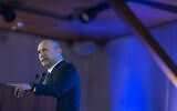 Former prime minister Naftali Bennett speaks at the Conference of Presidents of Major American Jewish Organizations in Jerusalem, on February 17, 2026. (Yonatan Sindel/Flash90)