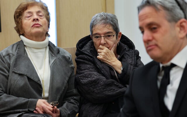 Carol Fessler, center, charged in the hit-and-run death of 4-year-old Rafael Adana, arrives for a court hearing in Petah Tikva, February 23, 2026. (Jonathan Shaul/Flash90) Carol Fessler, center, charged in the hit-and-run death of 4-year-old Rafael Adana, arrives for a court hearing in Petah Tikva, February 23, 2026. (Jonathan Shaul/Flash90)