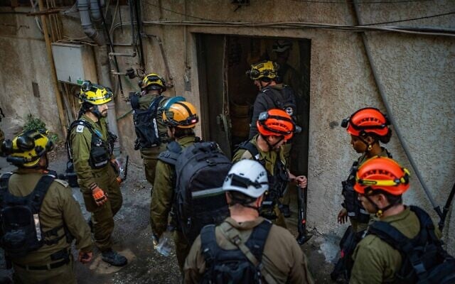 Israeli rescue and emergency forces at the scene where shrapnel from a ballistic missile fired from Iran fell in central Israel, February 28, 2026. (Flash90) Israeli rescue and emergency forces at the scene where shrapnel from a ballistic missile fired from Iran fell in central Israel, February 28, 2026. (Flash90)