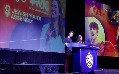 Leo Coen and Raquel Rogoff present the Jewish Youth Assembly resolution at the BBYO International Convention on February 14, 2026. (Jewish Telegraphic Agency)