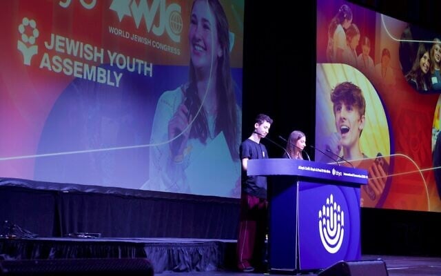 Leo Coen and Raquel Rogoff present the Jewish Youth Assembly resolution at the BBYO International Convention on February 14, 2026. (Jewish Telegraphic Agency)