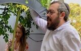 Nikki Goldstein and Rabbi Eli Schlanger celebrate Sukkot. (Courtesy via JTA)