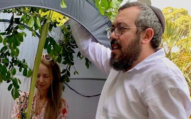 Nikki Goldstein and Rabbi Eli Schlanger celebrate Sukkot. (Courtesy via JTA) Nikki Goldstein and Rabbi Eli Schlanger celebrate Sukkot. (Courtesy via JTA)