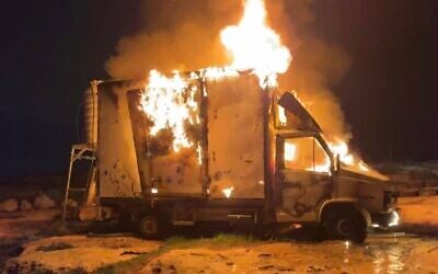 Flames pour out of a truck in a screenshot taken from footage of an apparent settler attack in the Palestinian village of Susya, in the southern West Bank, on February 24, 2026. (Screenshot: X, used in accordance with Clause 27a of the Copyright Law)