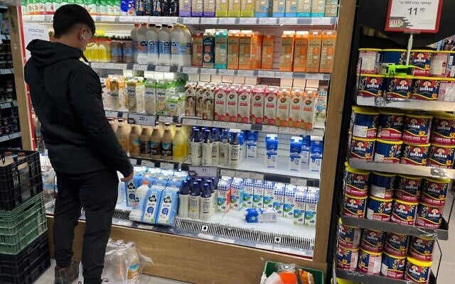 The dairy counter in a Jerusalem supermarket offering the cow-free New Milk by tech company Remilk among regular dairy options and other milk substitutes on January 29, 2026. (Rossella Tercatin/Times of Israel)