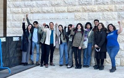 Some of the young people behind Israel's first High Court petition on climate action, outside the High Court in Jerusalem, on February 23, 2026. Green Trend's CEO Elad Hochman is wearing a white jacket.(Green Trend).