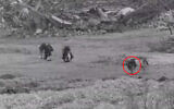 Palestinian terror operatives are seen approaching Israeli troops in the northern Gaza Strip, in footage published by the military on February 14, 2026. (Israel Defense Forces)