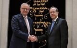 President Isaac Herzog, right, and Australian Prime Minister Anthony Albanese, shake hands at the Chabad of Bondi in Sydney, Australia, February 10, 2026. (GPO/Maayan Toaf)