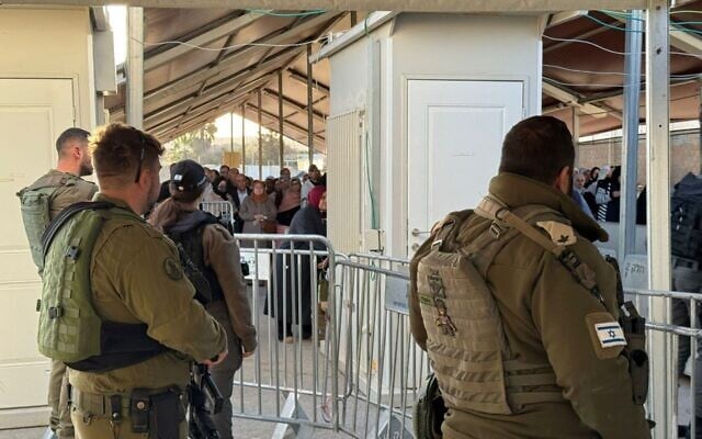 Israeli soldiers are seen at the Qalandiya checkpoint near Jerusalem as West Bank Palestinians make their way to the Al-Aqsa Mosque for Ramadan prayers, February 20, 2026. (Courtesy) Israeli soldiers are seen at the Qalandiya checkpoint near Jerusalem as West Bank Palestinians make their way to the Al-Aqsa Mosque for Ramadan prayers, February 20, 2026. (Courtesy)