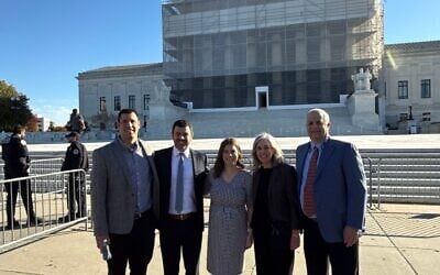 From left, Ben Woldenberg, Stephen Woldenberg, Elana Woldenberg Ruffman, Nadine Woldenberg and Rick Woldenberg pose in front of the Supreme Court building in Washington, DC. (Courtesy Stephen Woldenberg via JTA)