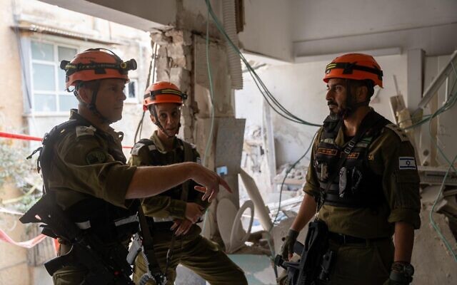 Home Front Command chief Maj. Gen. Shai Klapper (left) is seen alongside other officers at a home in central Israel hit by an Iranian cluster bomb munition, March 9, 2026. (Israel Defense Forces) Home Front Command chief Maj. Gen. Shai Klapper (left) is seen alongside other officers at a home in central Israel hit by an Iranian cluster bomb munition, March 9, 2026. (Israel Defense Forces)