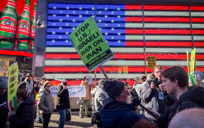 A rally opposing US and Israeli strikes against Iran, in Times Square, New York City, March 1, 2026. (Luke Tress/Times of Israel)