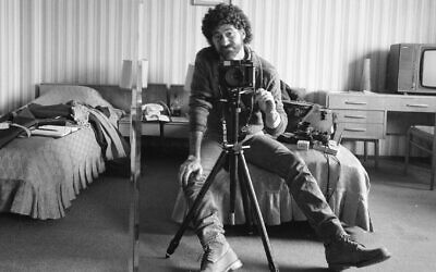 Photographer Edward Serotta takes a self-portrait in a hotel room during his efforts to document Romania in the 1980s. (Courtesy Serotta via JTA)