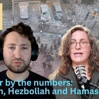 Rescue workers gather at the site where Israeli airstrikes hit apartments in Beirut, Lebanon, March 11, 2026. (AP Photo/Hussein Malla)