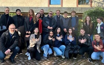 Students and their teachers from Berlin’s Refik Veseli School and Tirana’s Gjimnazi Sami Frashëri pose for a group shot in front of Albania’s Ministry for Europe and Foreign Affairs on International Holocaust Remembrance Day, January 27, 2026. (Larry Luxner/ JTA)
