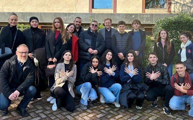 Students and their teachers from Berlin’s Refik Veseli School and Tirana’s Gjimnazi Sami Frashëri pose for a group shot in front of Albania’s Ministry for Europe and Foreign Affairs on International Holocaust Remembrance Day, January 27, 2026. (Larry Luxner/ JTA)