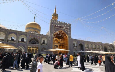 Pilgrims gather at the shrine of Imam Reza in the city of Mashhad, northeastern Iran, on October 1, 2023. (Photo by ATTA KENARE / AFP)