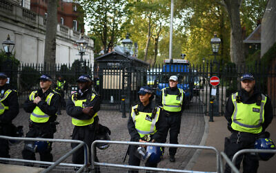 Police officers stand on duty at a road leading to the Embassy of Israel, as anti-Israel protesters take part in a nearby 'Stand with Palestine' demonstration, in west London on October 9, 2023. (Daniel LEAL / AFP) Police officers stand on duty at a road leading to the Embassy of Israel, as anti-Israel protesters take part in a nearby 'Stand with Palestine' demonstration, in west London on October 9, 2023. (Daniel LEAL / AFP)