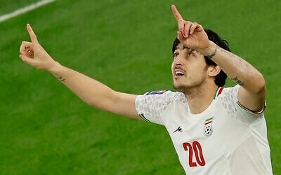 Iran's forward Sardar Azmoun celebrates after scoring his team's first goal during the Qatar 2023 AFC Asian Cup semi-final football match between Iran and Qatar at al-Thumama Stadium in Doha on February 7, 2024 (Karim Jaafar / AFP)
