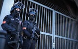 Illustrative: Armed police stand guard on April 1, 2025 at the compound of the court building in Celle, northern Germany. (RONNY HARTMANN / POOL / AFP)